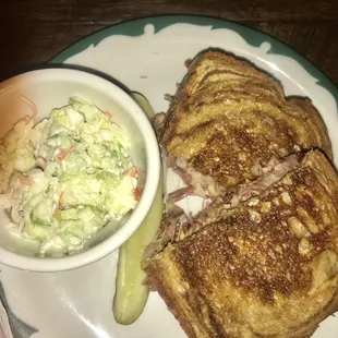 a grilled cheese sandwich with a side of coleslaw