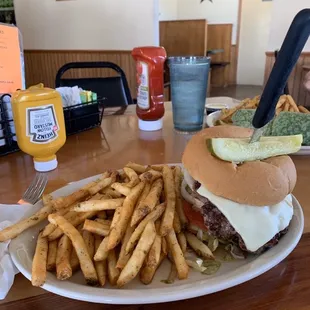 a burger and fries on a plate