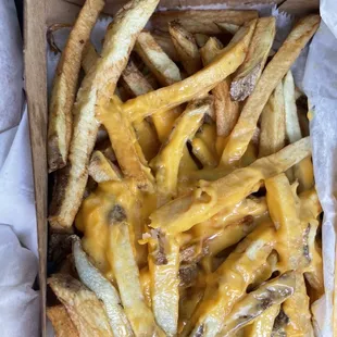 a box of cheese fries