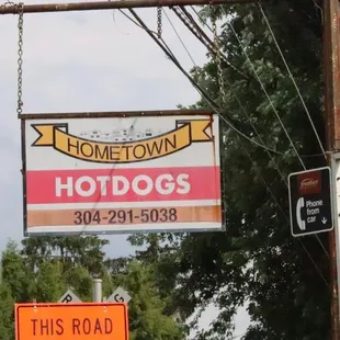 a sign for a hot dog shop