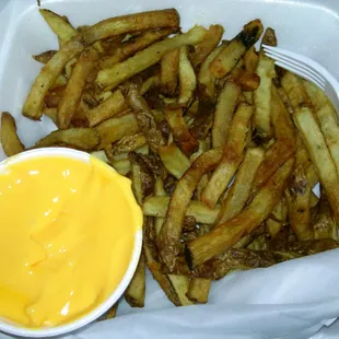 Hand cut fries with cheese sauce on the side