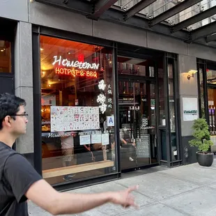 a man walking down the sidewalk