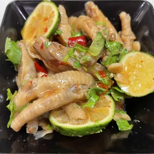 a black square plate of food