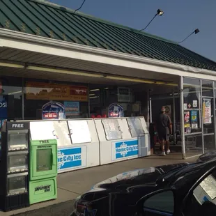 a man standing in front of a vending machine