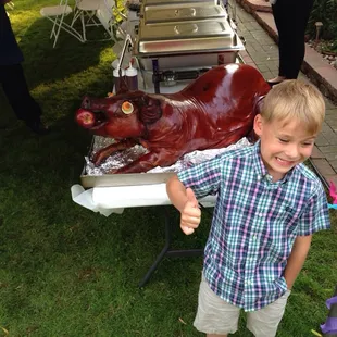 My son at a pig roast done by Hometown Meats.