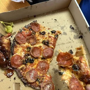 Cauliflower pizza with pepperoni, olives and tomatoes