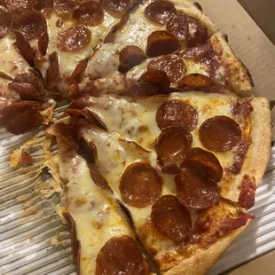 a pepperoni pizza in a box