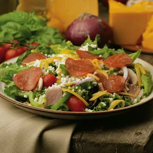 Hometown Pizza Salad. Served with fresh, hot garlic bread.