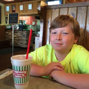 Slurping down a soda waiting for the breadsticks.