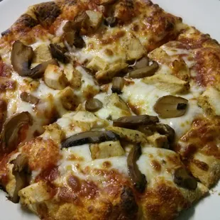a pizza with mushrooms and cheese