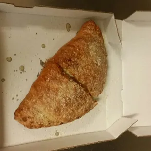 a half eaten pizza in a box