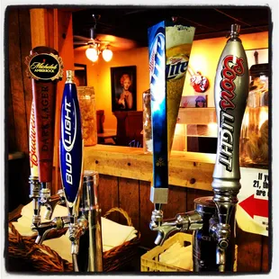 a row of beer taps