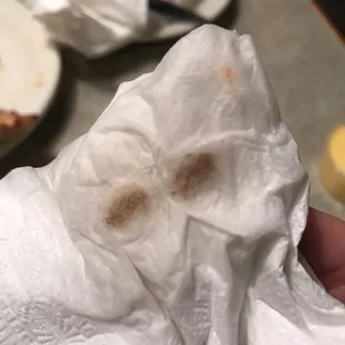 a hand holding a piece of paper