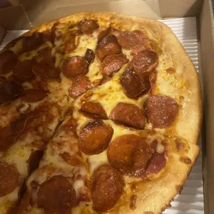 a pepperoni pizza in a box