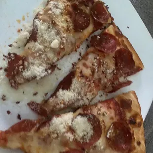 two slices of pepperoni pizza