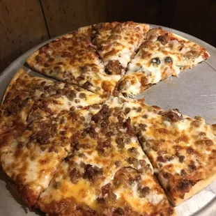 a sliced pizza on a pan