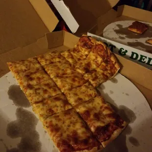 a slice of cheese pizza on a plate