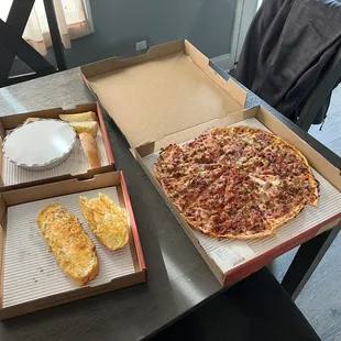 two pizzas and a slice of pizza