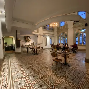 a dining room with tables and chairs
