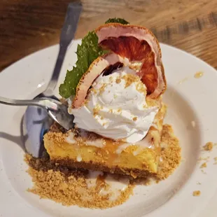 Burnt Blood Orange Marmalade drizzled cheesecake bars with Rosamary Vanilla glaze.