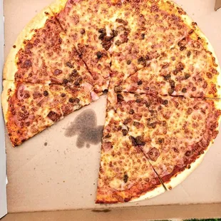 Pizza with most ingredients in the very center of the pizza, with virtually none towards the edges. Little to no cheese towards the crust.