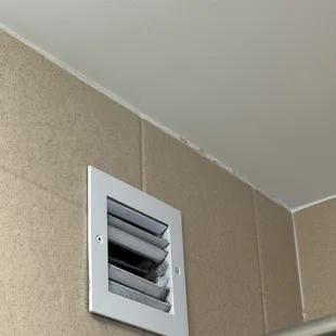 Dusty disgusting air vent in bathroom