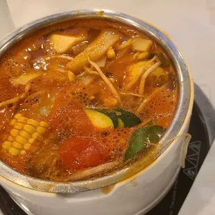 A large variety of meats and veggies to select from on buffet.