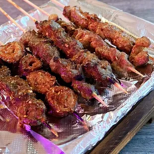 Left to Right: Chicken Gristle, Pork Intestines, Beef Skewer x2, Lamb Skewer x2 | $2.50-$3.25 each