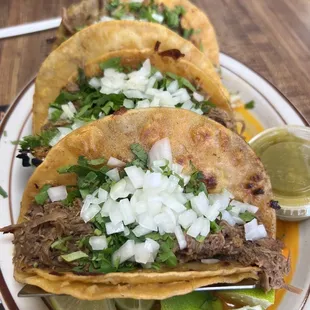 Birria tacos and consome