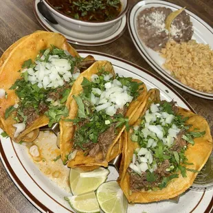 Birria tacos and consome