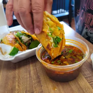 The Dipping Of The Taco In The Broth