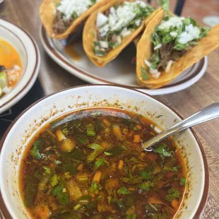 Birria tacos and consome