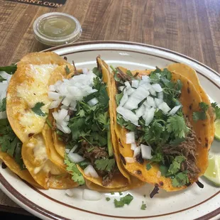 Birria tacos and consome