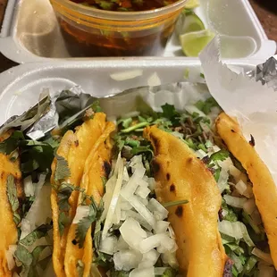 Birria tacos and consome