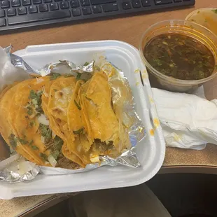 Birria tacos and consome