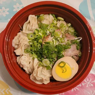 a bowl of ramen and an egg