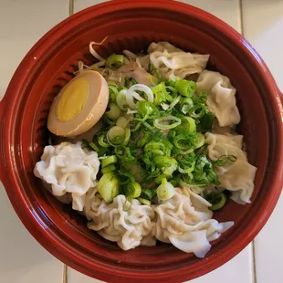 an overhead view of a bowl of food