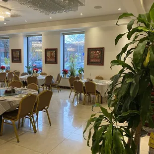 a restaurant with tables and chairs