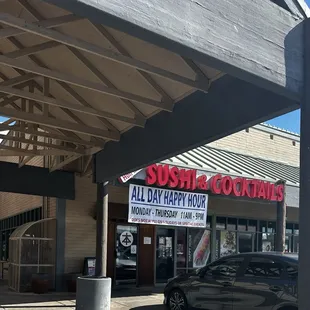 a car parked in front of a restaurant