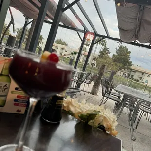 Patio view / pomegranate martini