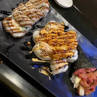 Left to right. Dynamite roll. Baked crawfish roll. Spicy hamachi roll. 10/10!!!