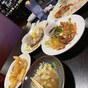 Shrimp tempura, ika karaage, hamachi Kama, and house salad.