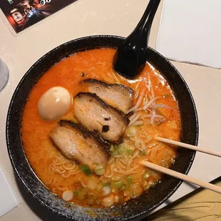 a bowl of ramen and chopsticks