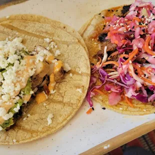 Pollo Asado (l) &amp; Korean Pulled Pork (r) Tacos
