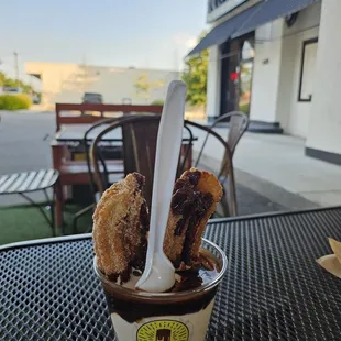 Frozen churro with chocolate sauce