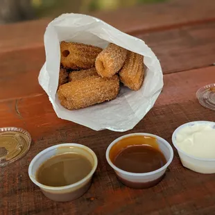 6-piece mini churro with coffee, caramel, and cream cheese sauces (left to right)