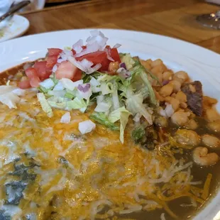 Chicken enchiladas (Christmas-style with red and green chili sauce)