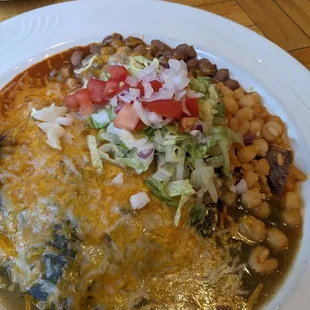 Chicken enchiladas (Christmas-style with red and green chili sauce)
