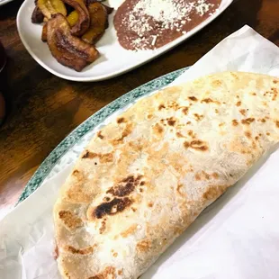 a tortilla and a side of beans