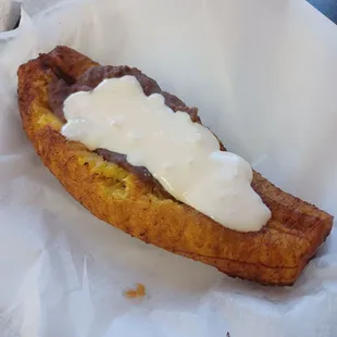 a banana bread with cream on top